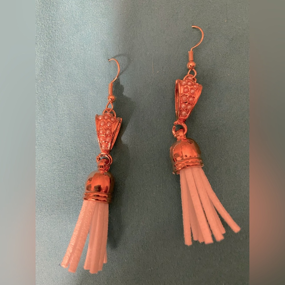 Rose gold tone earrings with white tassel